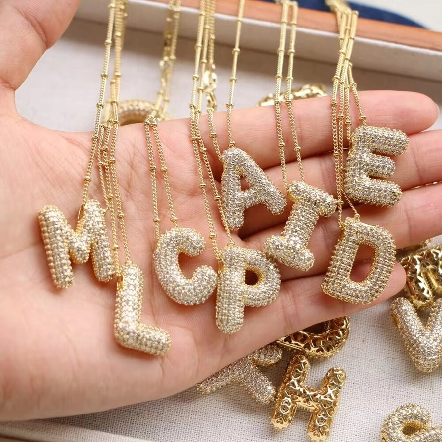 COLLAR LETRA GLOBO BRILLOS